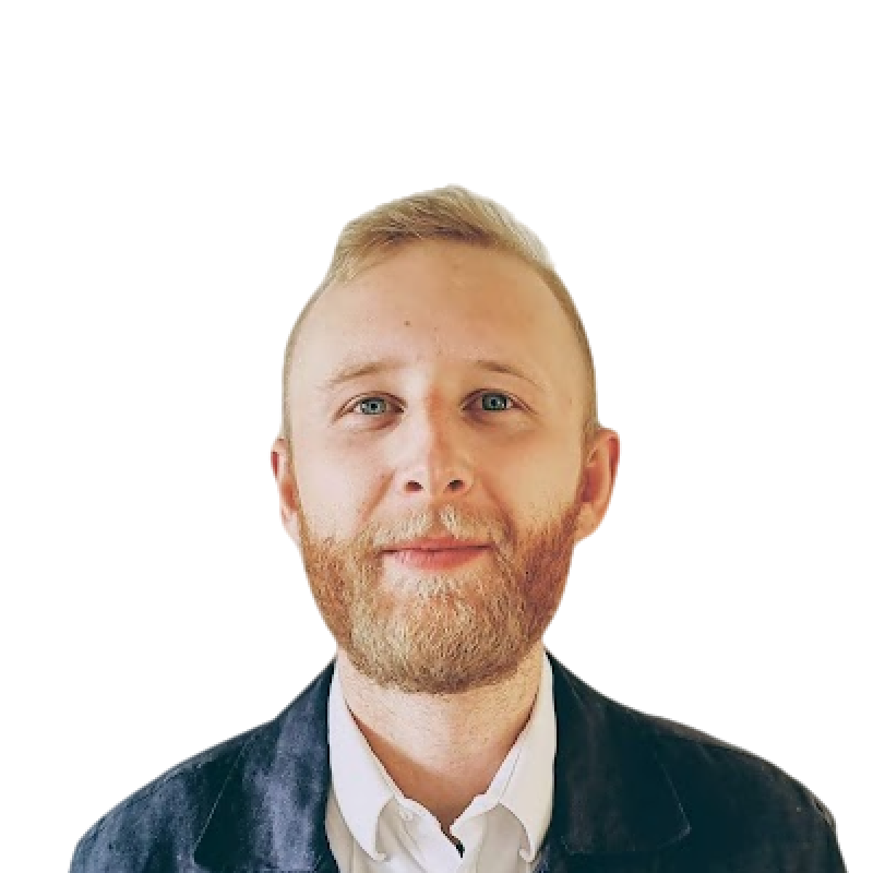 Alexander Härenstam smiling in a red plaid shirt and tortoise shell glasses